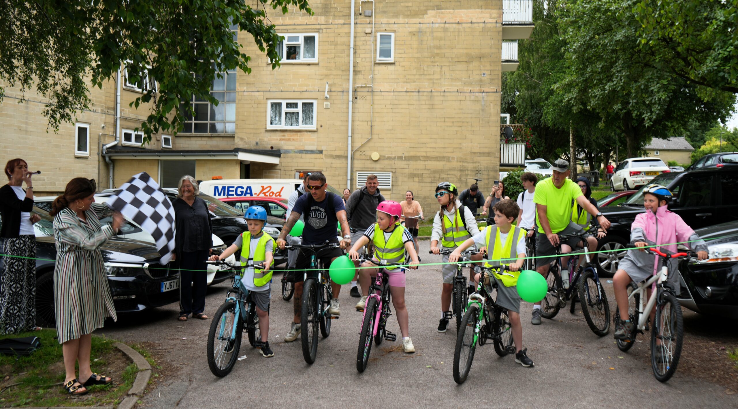Families setting off from Meade House on their cycle challenge